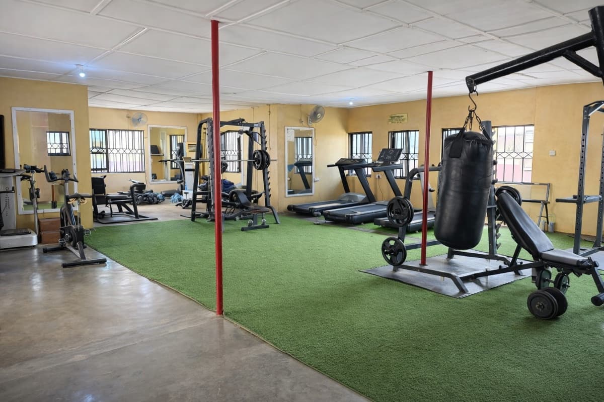 Gym with treadmills, free weights and punching bag