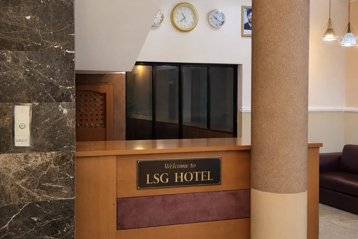Hotel reception with staff attending to guests